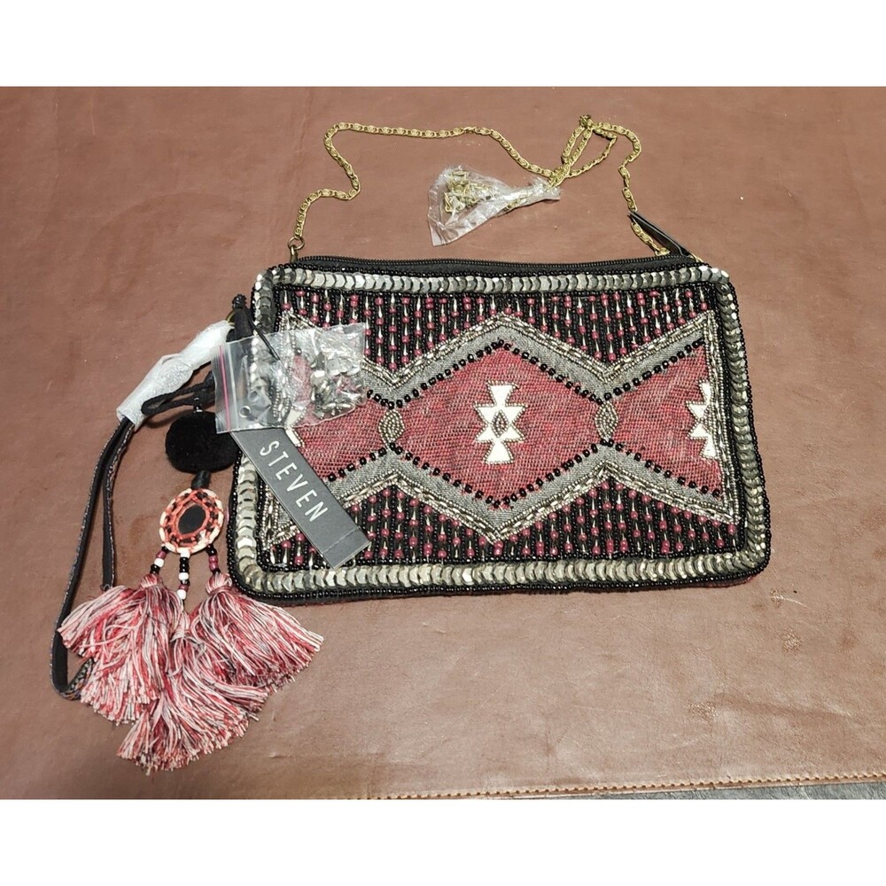 This Steve Madden beaded sequin crossbody purse features a geometric pattern in